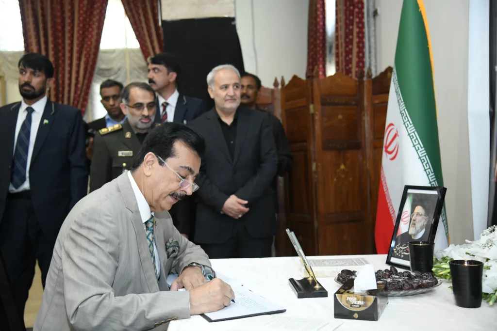 Acting President Syed Yousuf Raza Gillani penned down condolatory remarks over the sad demise of the President of Iran Dr Seyyed Ebrahim Raisi, in the visitor's book, during his visit to the Embassy of Iran,