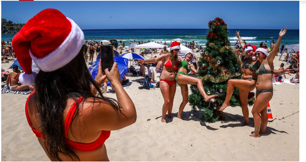Tourists pose for a photo at Sydney's Bondi Beach on December 25, 2024. David Gray/AFP/Getty Images